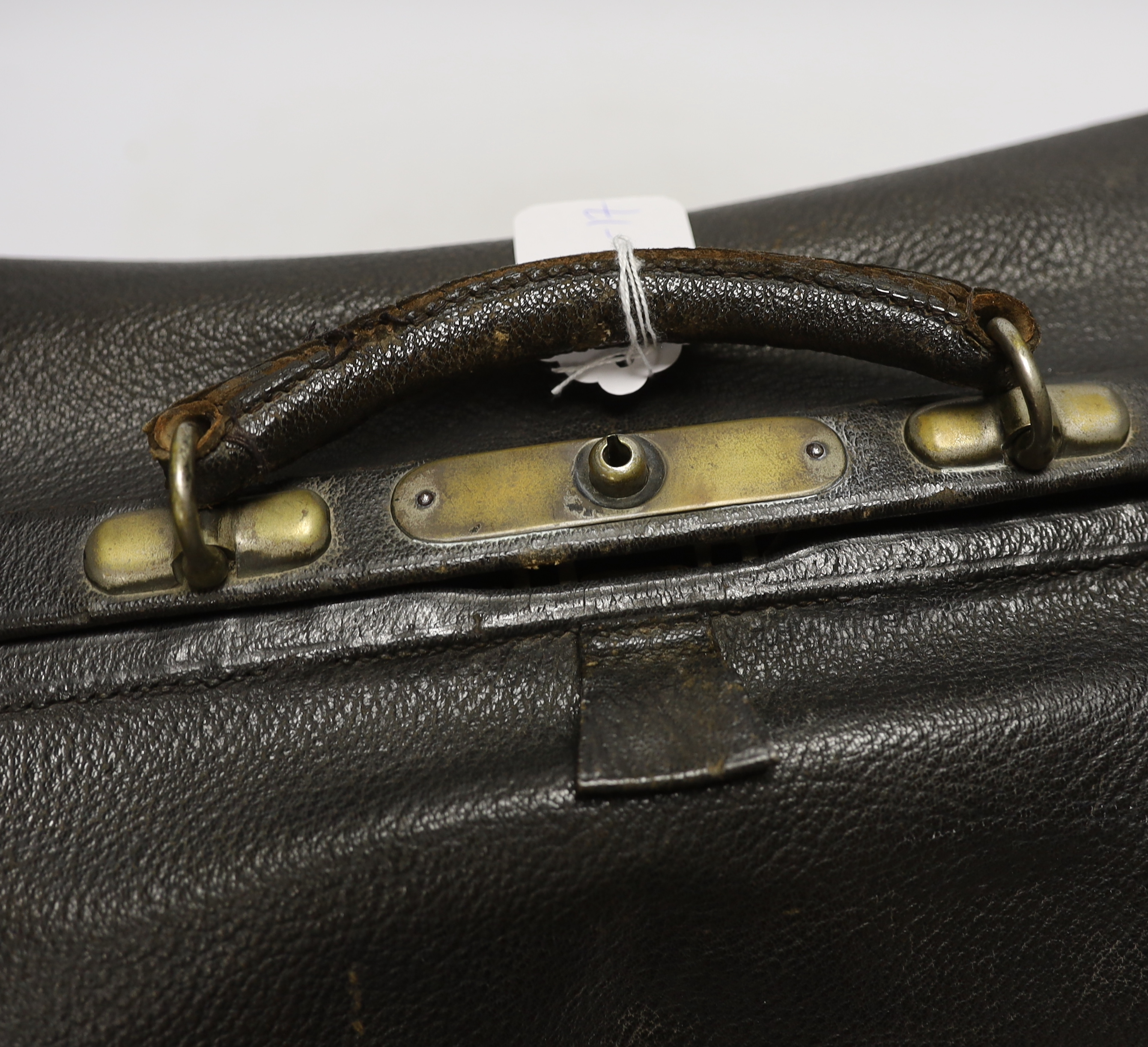 A black leather Gladstone bag